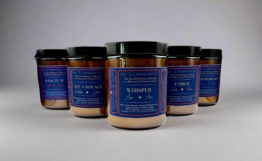 Row of candles with labels on a textured white surface