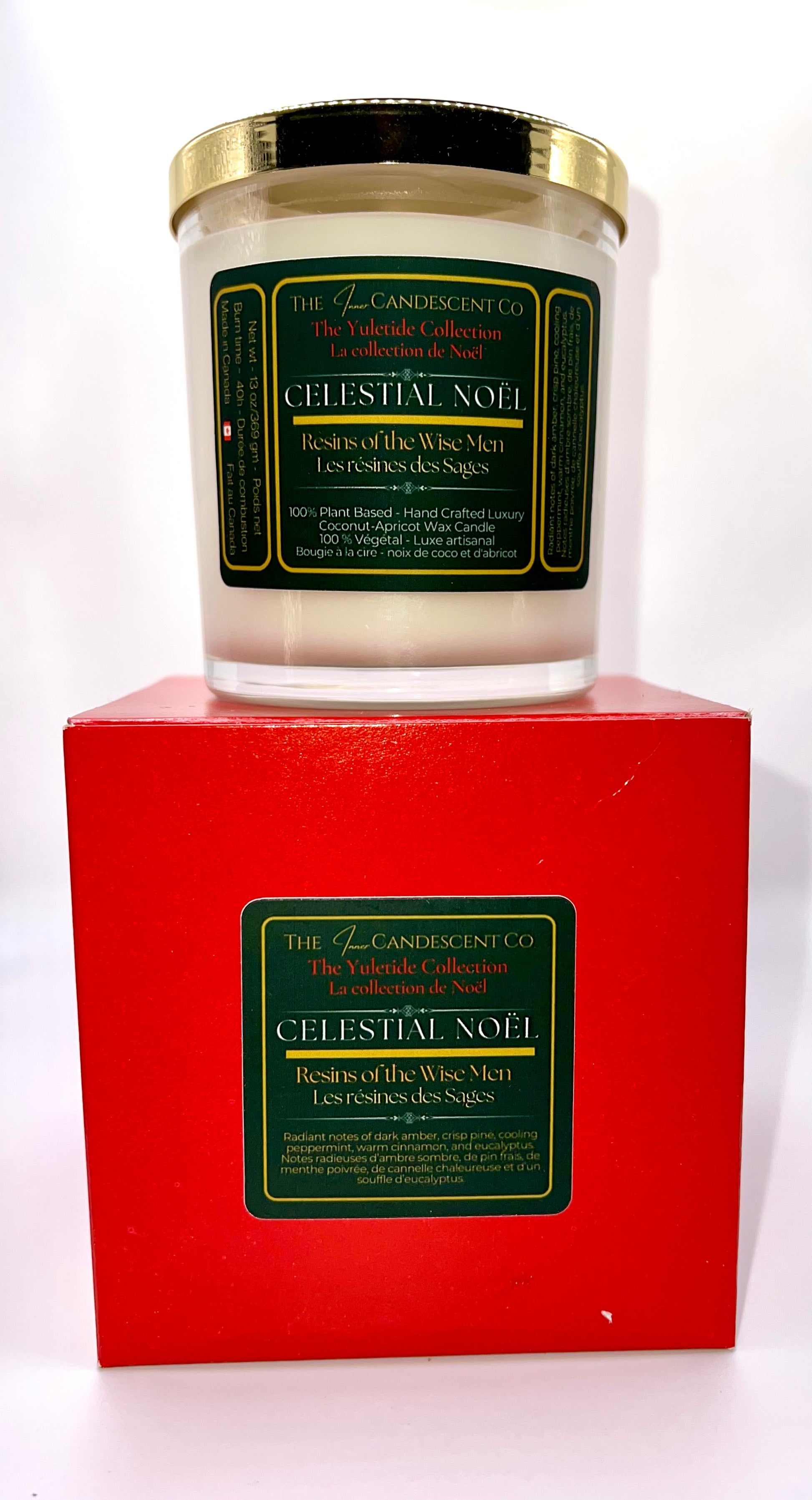 Candle in a red box with a green label on a white background