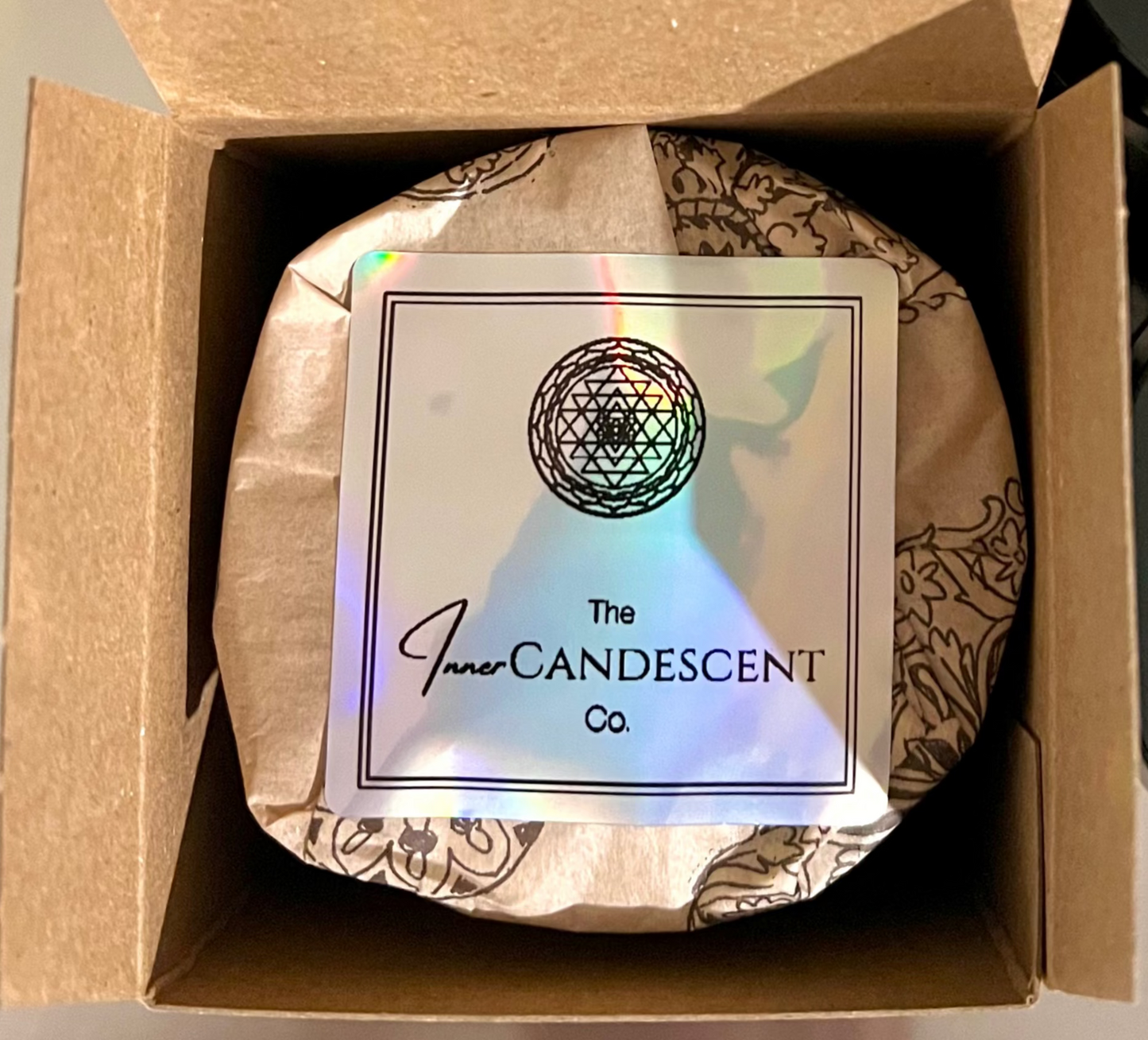 Candle in a box with 'The InnerCandescent Co' label