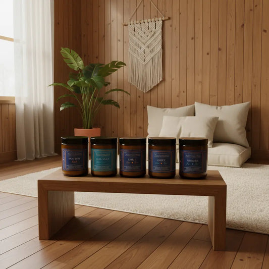5 candles on a wooden bench in a spa setting