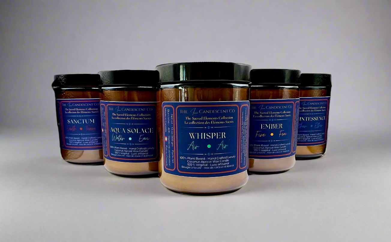 Row of candles with labels on a textured white surface