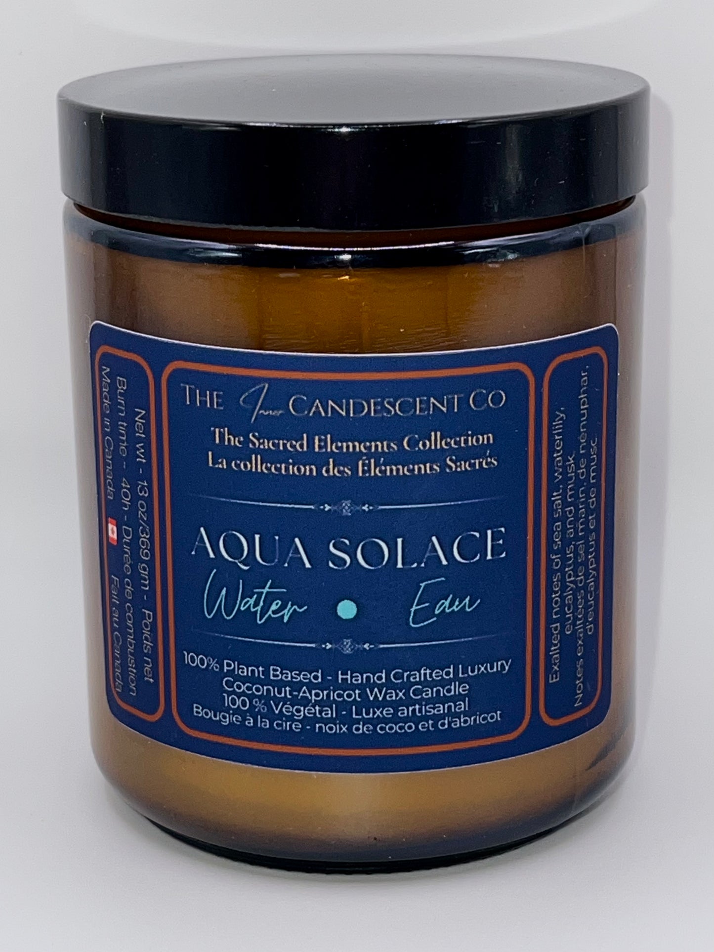 Candle jar labeled 'Aqua Solace' from The Candescent Co on a white background