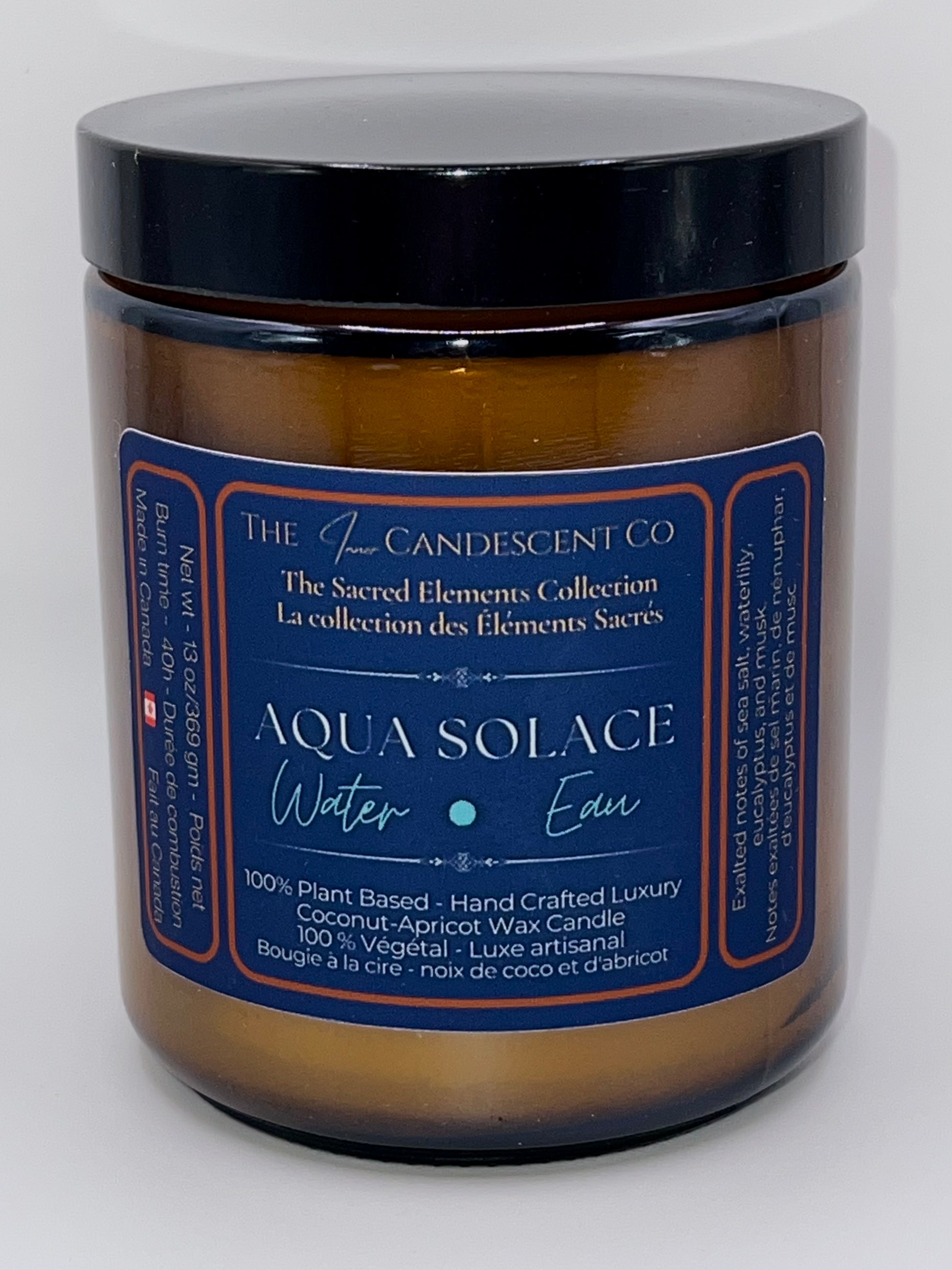 Candle jar labeled 'Aqua Solace' from The Candescent Co on a white background