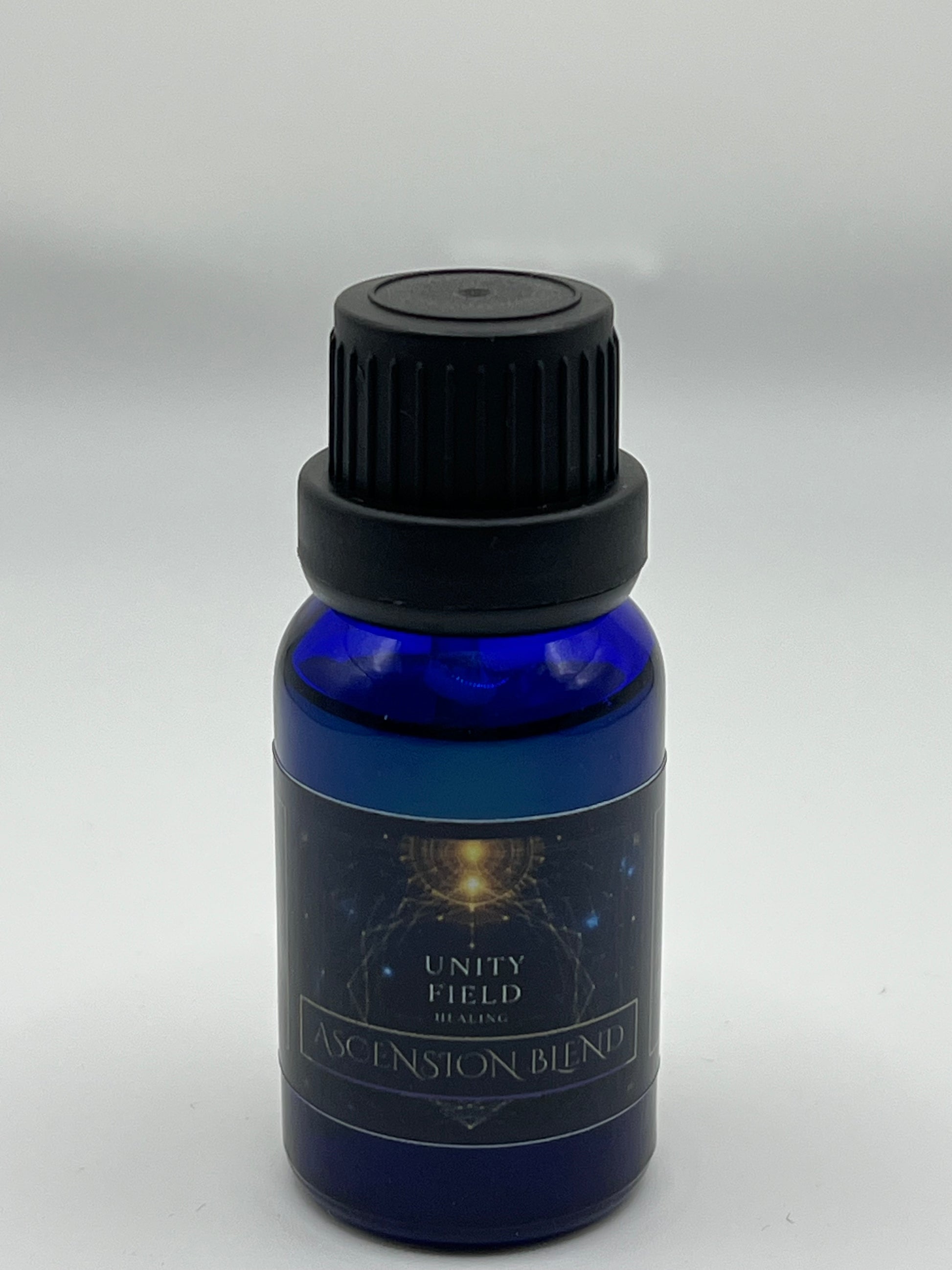 Blue bottle with black cap labeled 'Unity Field Ascension Blend' on a white background