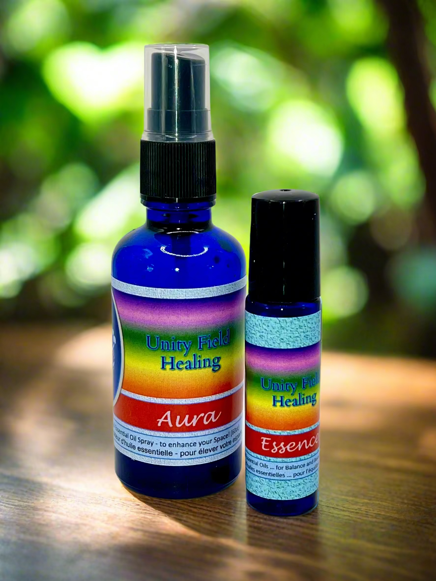 Two bottles of Unity Field Healing spray on a white background
