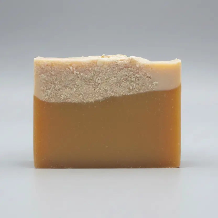 Bar of soap on a textured surface.