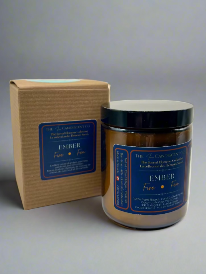 Candle jar with lid and packaging on a white surface