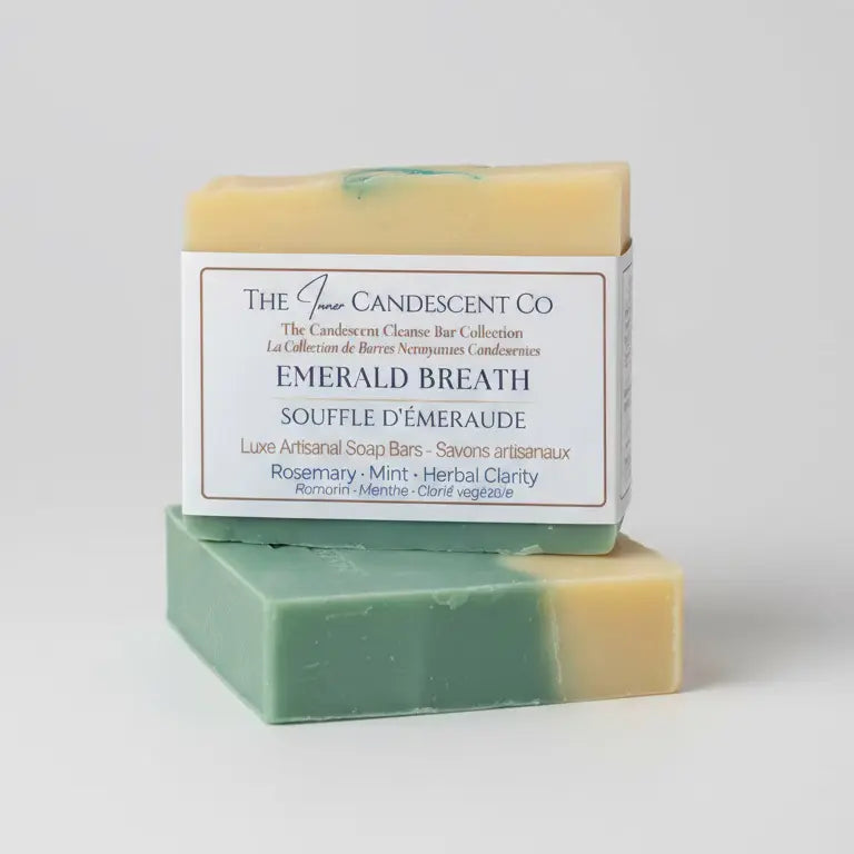 Two soap bars with a visible label on a textured surface