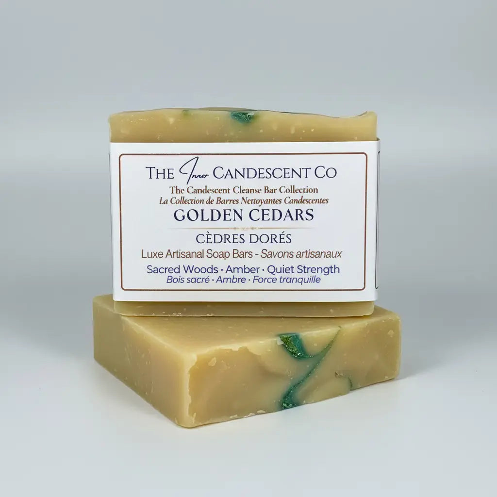 Two bars of soap with a label for 'The Inner Candescent Co' on a textured surface.