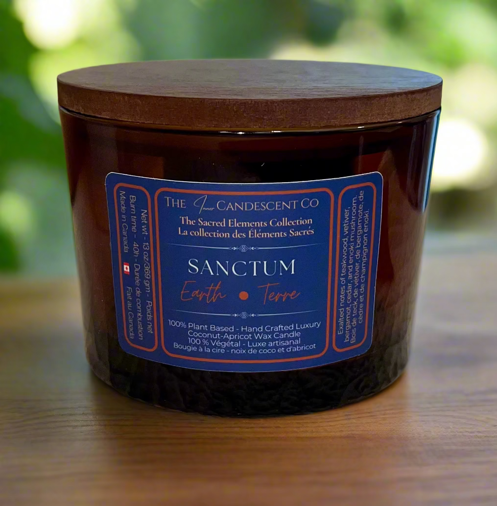 Brown candle with a blue label on a textured surface