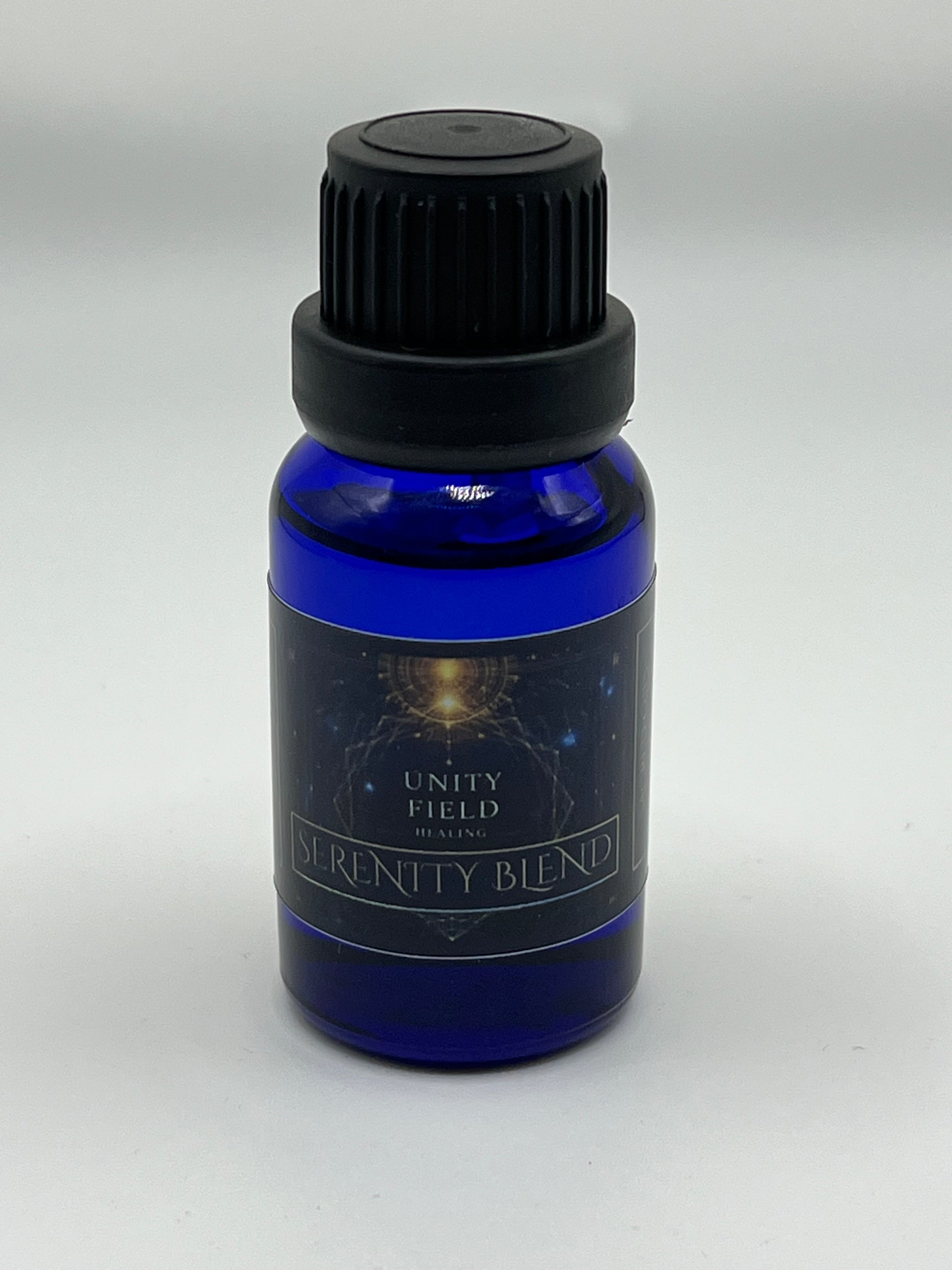 Blue essential oil bottle with black cap on a white background