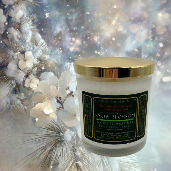 Snow Blossom candle with gold lid on a decorative background