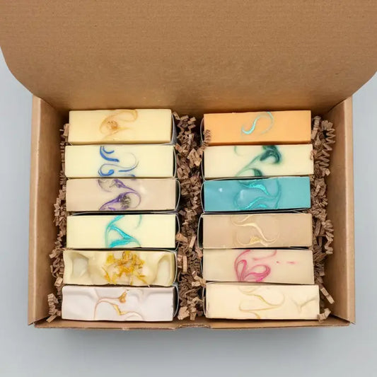 Box of soap bars with decorative elements on a textured surface